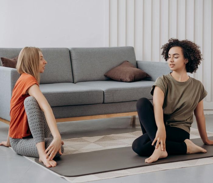 Person stretching peacefully with a calm and focused expression.